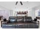 Comfortable living room features a spacious layout that flows seamlessly into the kitchen and dining area at 15062 Hummingbird Rd, Weeki Wachee, FL 34614