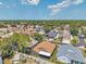 Scenic aerial view of residential area boasting well-kept homes, green spaces, and a serene atmosphere at 1747 Wood Brook St, Tarpon Springs, FL 34689