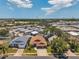Expansive aerial view of a residential neighborhood with well-maintained homes and lush greenery at 1747 Wood Brook St, Tarpon Springs, FL 34689