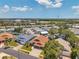 Gorgeous aerial photo of a neighborhood with a blend of home designs and lush greenery at 1747 Wood Brook St, Tarpon Springs, FL 34689