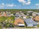 Impressive aerial view of a community featuring various home styles and mature trees in a desirable location at 1747 Wood Brook St, Tarpon Springs, FL 34689