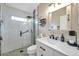 Modern bathroom featuring a sleek shower with glass door, and stylish vanity with contemporary fixtures at 1747 Wood Brook St, Tarpon Springs, FL 34689