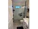 Modern bathroom featuring a glass-enclosed shower and sleek vanity at 1747 Wood Brook St, Tarpon Springs, FL 34689