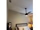Bedroom with hardwood floors, ceiling fan, and upholstered headboard at 1747 Wood Brook St, Tarpon Springs, FL 34689