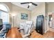 Home Office has wood floors, ceiling fan, large window and a safe at 1747 Wood Brook St, Tarpon Springs, FL 34689