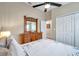 Light bedroom featuring closet doors, dresser, and a window at 1747 Wood Brook St, Tarpon Springs, FL 34689