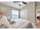 Bedroom with hardwood floors, a ceiling fan and a double closet at 1747 Wood Brook St, Tarpon Springs, FL 34689