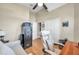 This bedroom has wood floors, ceiling fan and a safe at 1747 Wood Brook St, Tarpon Springs, FL 34689