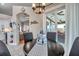 Bright dining area with backyard patio views, showcasing stylish decor and an open floor plan at 1747 Wood Brook St, Tarpon Springs, FL 34689