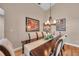 Dining room with a large dining table, seating for six, and a decorative chandelier at 1747 Wood Brook St, Tarpon Springs, FL 34689