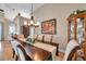 Formal dining room featuring a large table with upholstered chairs and a decorative chandelier at 1747 Wood Brook St, Tarpon Springs, FL 34689