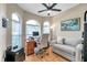Inviting home office with arched windows, a comfortable seating area, and a traditional wooden desk at 1747 Wood Brook St, Tarpon Springs, FL 34689