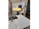 Bright kitchen features white cabinets, stainless steel appliances, and stylish countertops at 1747 Wood Brook St, Tarpon Springs, FL 34689