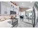 Bright, modern kitchen with white cabinets, stainless steel appliances, and an open layout at 1747 Wood Brook St, Tarpon Springs, FL 34689