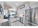 The kitchen has a modern design, stainless steel appliances, and white cabinets at 1747 Wood Brook St, Tarpon Springs, FL 34689
