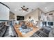 Spacious living room featuring a stone fireplace, hardwood floors, and comfortable seating at 1747 Wood Brook St, Tarpon Springs, FL 34689