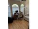 Bright office space featuring large windows, a desk with rolling chair, and an upholstered sofa at 1747 Wood Brook St, Tarpon Springs, FL 34689