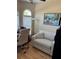 Bright office space features large windows, a desk with rolling chair, and an upholstered sofa at 1747 Wood Brook St, Tarpon Springs, FL 34689