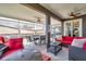 Entertainer's patio featuring ceiling fans, dining area, and comfortable lounge seating for outdoor enjoyment at 1747 Wood Brook St, Tarpon Springs, FL 34689