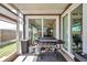 Well-equipped patio with built-in grill and outdoor seating, perfect for outdoor dining and entertaining at 1747 Wood Brook St, Tarpon Springs, FL 34689