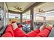 Comfortable, screened patio with ceiling fans and ample seating for lounging or outdoor dining at 1747 Wood Brook St, Tarpon Springs, FL 34689