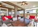 Spacious screened patio with a dining table and comfortable seating area perfect for outdoor gatherings at 1747 Wood Brook St, Tarpon Springs, FL 34689