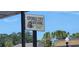 Exterior sign for Sponge City Brewing includes logo and lists the tap room, kitchen and beer garden at 1747 Wood Brook St, Tarpon Springs, FL 34689