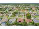 Community aerial view featuring lush landscaping, mature trees and well-maintained properties at 1831 Stable Trl, Palm Harbor, FL 34685