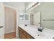 Bathroom featuring double sinks and light fixtures at 1831 Stable Trl, Palm Harbor, FL 34685