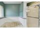 Clean and modern bathroom featuring a soaking tub with tile surround and a glass shower enclosure at 1831 Stable Trl, Palm Harbor, FL 34685