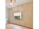 Neutral bedroom featuring hardwood floors, light walls, and window at 1831 Stable Trl, Palm Harbor, FL 34685