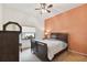 Bedroom features a bed, bedside table, a window, and closet at 1831 Stable Trl, Palm Harbor, FL 34685