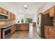 Spacious kitchen with tile floors, stainless steel appliances, and granite counter tops at 1831 Stable Trl, Palm Harbor, FL 34685