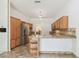 Spacious kitchen has stainless appliances, granite counter and wood cabinets at 1831 Stable Trl, Palm Harbor, FL 34685