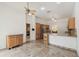 Kitchen with stainless steel appliances, tile floors, and kitchen island at 1831 Stable Trl, Palm Harbor, FL 34685