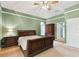 This main bedroom features a large bed and lots of space at 1831 Stable Trl, Palm Harbor, FL 34685