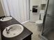 Bright bathroom featuring a double sink vanity and a convenient toilet and shower area at 1941 Arvis E Cir, Clearwater, FL 33764