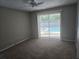 Bedroom offering a view of the pool through the sliding glass doors at 1941 Arvis E Cir, Clearwater, FL 33764