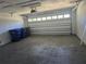 Spacious garage with an automatic door, ample storage, and a clean, well-maintained floor at 1941 Arvis E Cir, Clearwater, FL 33764