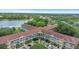 Breathtaking aerial shot of condo complex nestled in a lush, serene setting near the lake at 2021 Shangrila Dr # 14, Clearwater, FL 33763