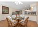 Bright dining area with open views to the kitchen at 2021 Shangrila Dr # 14, Clearwater, FL 33763