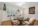 Cozy dining area with shuttered windows for natural light at 2021 Shangrila Dr # 14, Clearwater, FL 33763