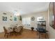 Comfortable dining space with a round table, seating for four, and views of the well-lit interior at 2021 Shangrila Dr # 14, Clearwater, FL 33763