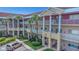 Well-maintained condo building with lush landscaping and ample parking at 2021 Shangrila Dr # 14, Clearwater, FL 33763