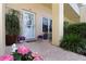 Charming front door with a decorated glass window and potted plants at 2021 Shangrila Dr # 14, Clearwater, FL 33763