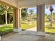 View from inside a community gazebo with view of grassy lawn with picnic tables at 2021 Shangrila Dr # 14, Clearwater, FL 33763