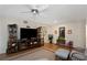 Bright living room showcasing a ceiling fan, a spacious layout, and contemporary decor at 2021 Shangrila Dr # 14, Clearwater, FL 33763