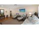 Cozy living room featuring hardwood floors, comfortable wicker seating, and soothing decor at 2021 Shangrila Dr # 14, Clearwater, FL 33763