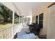 Inviting covered patio featuring comfortable seating and serene outdoor views at 2021 Shangrila Dr # 14, Clearwater, FL 33763