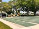 Organized shuffleboard courts provide a perfect spot for friendly games and community enjoyment amid mature trees at 2021 Shangrila Dr # 14, Clearwater, FL 33763